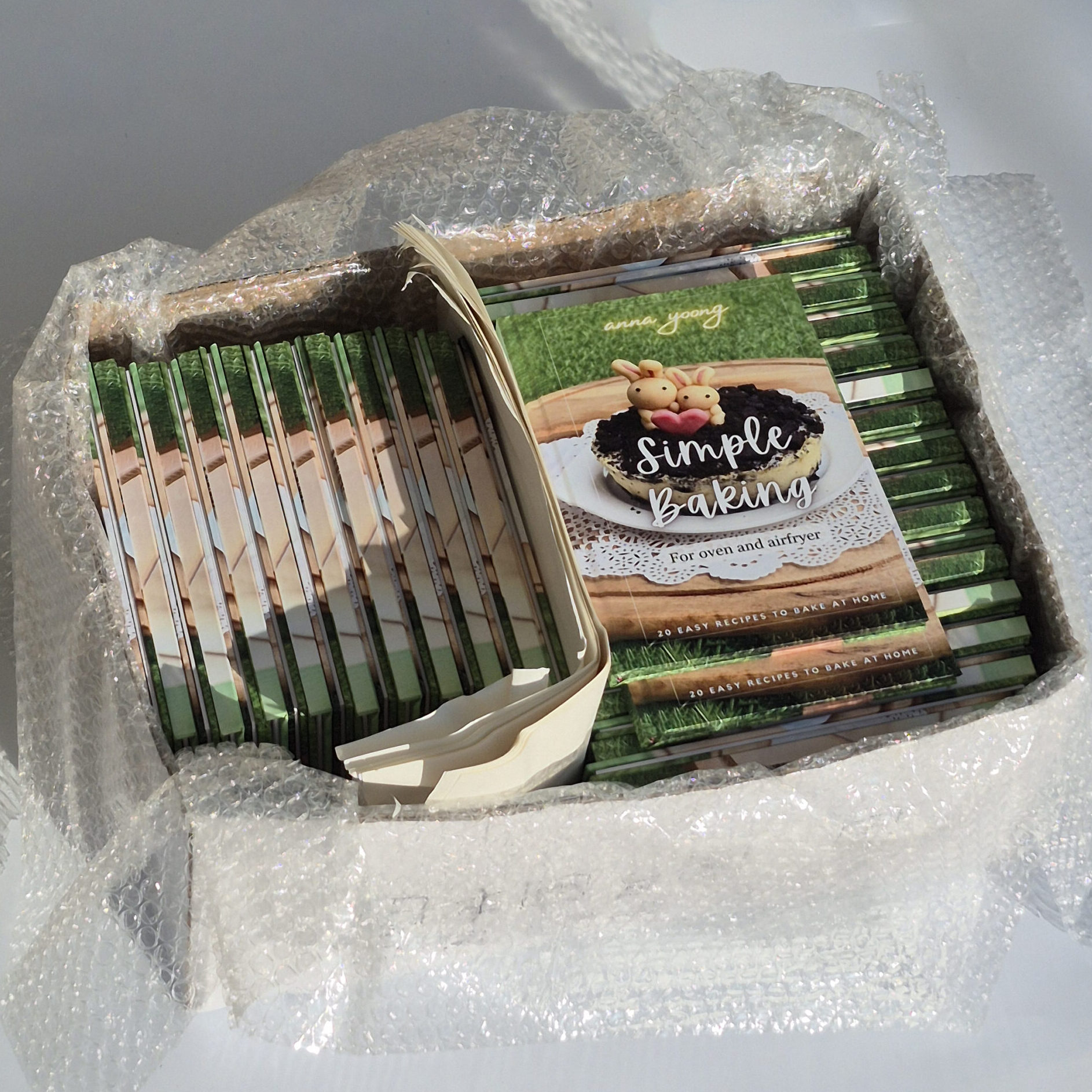 Bulk hardcover book printing orders packed for delivery in Singapore.