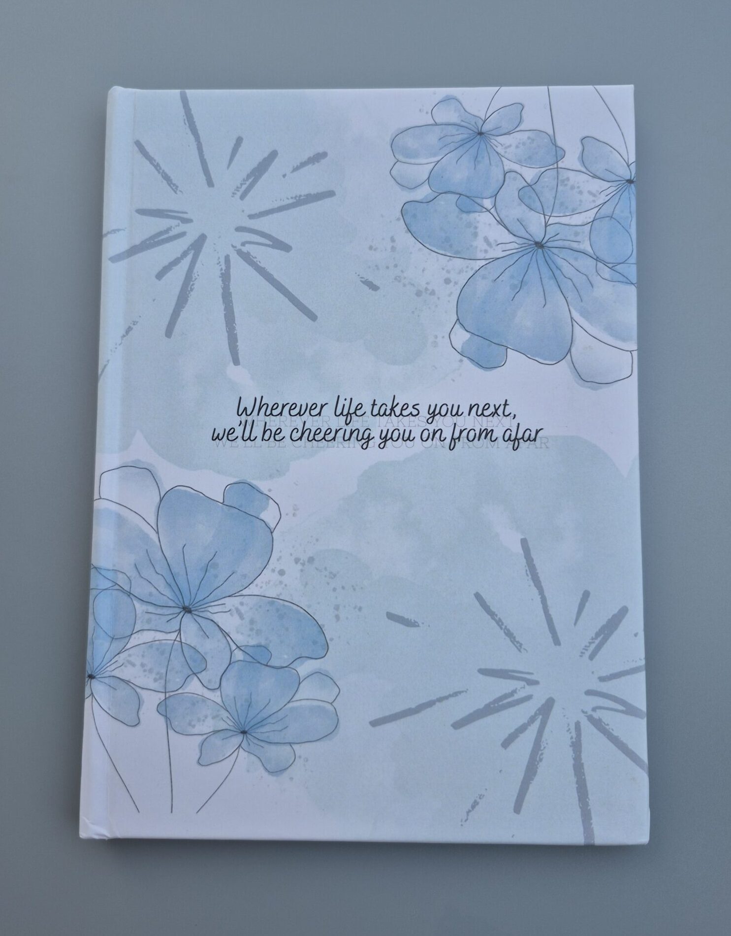 Hardcover book with floral-themed cover design, representing professional hardcover books printing in Singapore