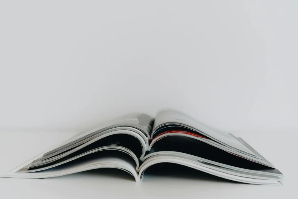 Book scanning vs reprinting viewed through a printed publication and physical format