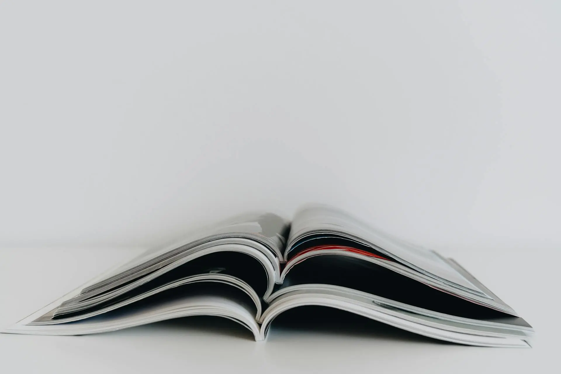 Book scanning vs reprinting viewed through a printed publication and physical format