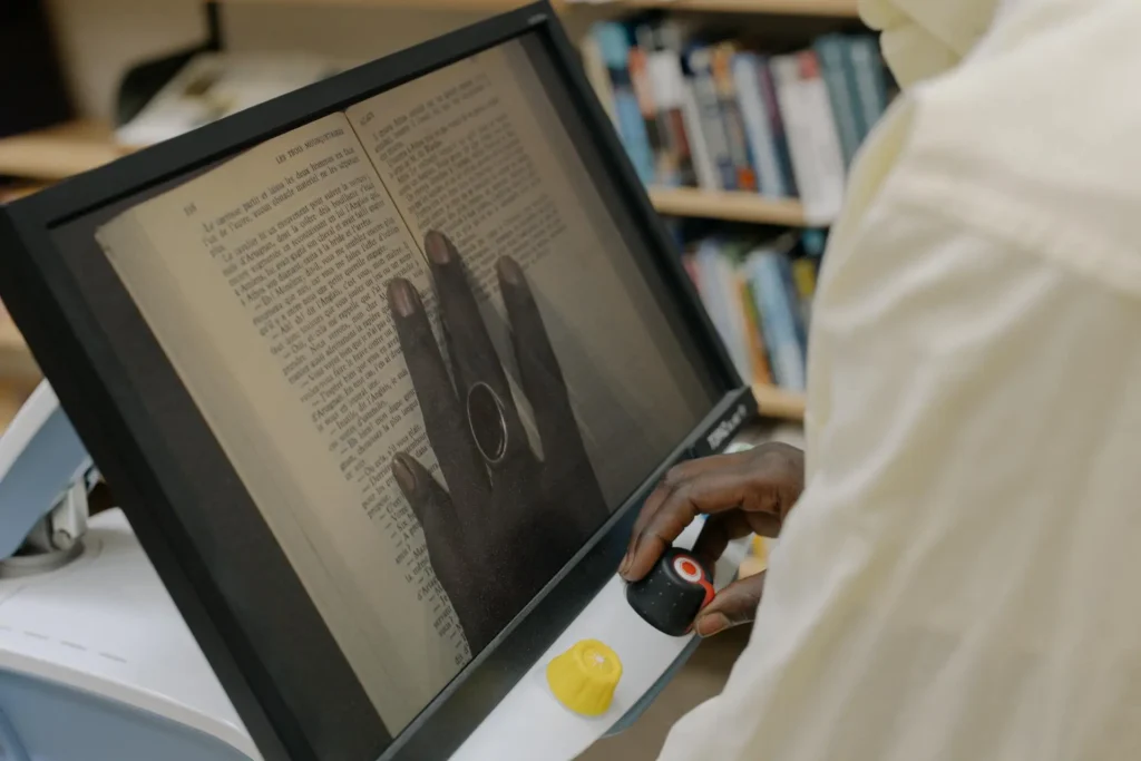 DIY vs professional book scanning showing a bound book being digitised using professional scanning equipment