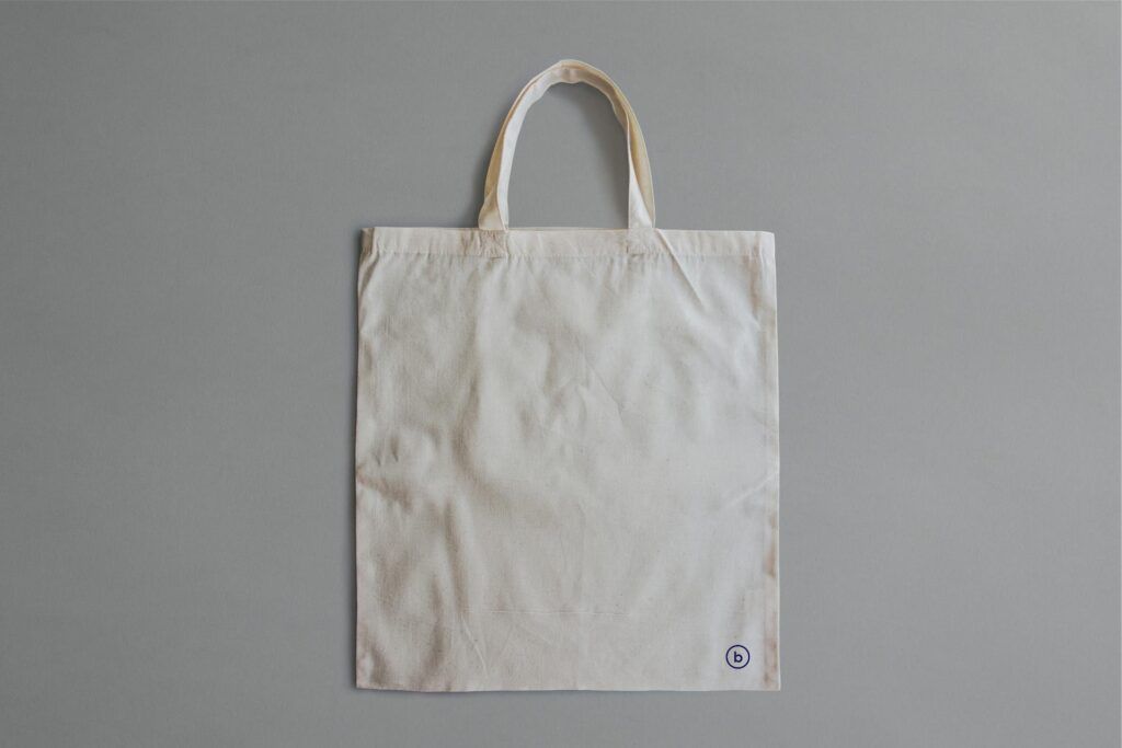 Plain cotton tote bag material commonly used for custom printing, promotional merchandise and reusable branded bags.