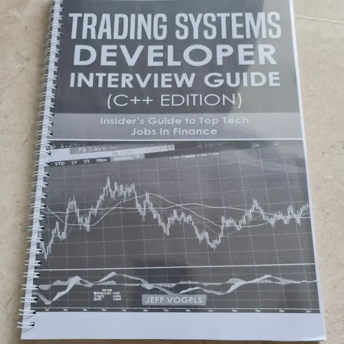 Coil bound training manual titled “Trading Systems Developer Interview Guide (C++ Edition)” printed with white spiral binding on beige background.