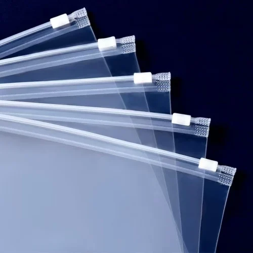 Transparent zipper packaging bags with slider closures and reinforced edges.